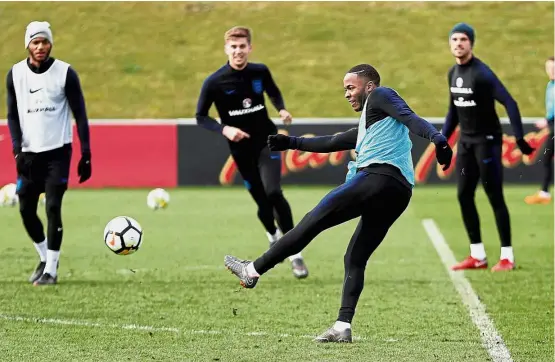  ?? — Reuters ?? Hard at work: Raheem Sterling kicking the ball during England’s training session at St George’s Park on Tuesday.
