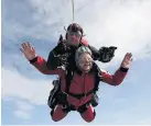  ??  ?? ●●Shirley McConnell, right, completing her skydive