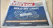  ?? REUTERS ?? The advertisem­ent, in the British daily Daily Mirror, is part of the company’s “Hold My Light” campaign.