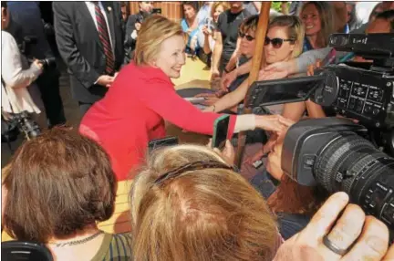  ?? GENE WALSH — DIGITAL FIRST MEDIA ?? Democratic presidenti­al candidate Hillary Clinton greets people outside Curds & Whey in Jenkintown on Friday after a Breaking Economics Barrier Conversati­on with Lilly Ledbetter.