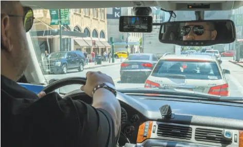  ?? Santiago Mejia / The Chronicle ?? Hemerson Reis drives through San Francisco with the Nexar app activated. The app turns a smartphone into a dash cam.