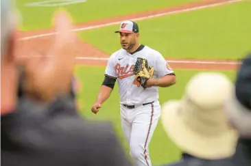  ?? KARL MERTON FERRON/STAFF ?? Albert Suárez, receiving a standing ovation at Camden Yards, basked in a day that had seemed unlikely ever to arrive.“I think I’m enjoying this moment more than the first time I got called up,” he said.