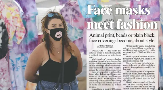  ?? (File photo/AP/Marcio Jose Sanchez) ?? Taylor Medina wears a mask as she sells June 27 in Huntington Beach, Calif.