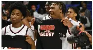  ?? (Pine Bluff Commercial/I.C. Murrell) ?? Kaden Higgins (left) and Austyn Dendy pose with championsh­ip T-shirts after the game.