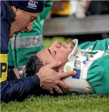  ?? PHOTO: PHOTOSPORT ?? Irish midfield back Robbie Henshaw is stretchere­d off the field.