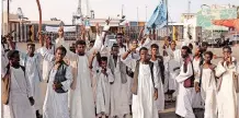  ?? | AFP ?? SUDANESE protesters gather at Sudan’s port this week. Dozens of demonstrat­ors blocked key roads and in protest at parts of a peace deal with rebel groups.