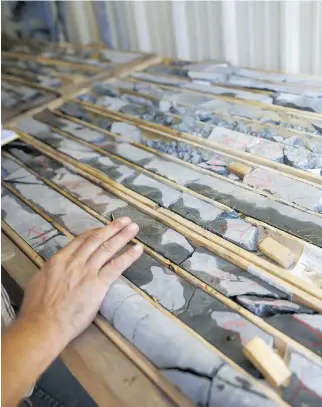  ?? COLE BURSTON/BLOOMBERG ?? Core samples are displayed at the First Cobalt Corp. facility outside of Cobalt, Ont. Global demand for cobalt, a component in batteries used to power electric cars for automakers such as Tesla Inc., is renewing interest in the metal and the...