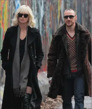  ??  ?? Charlize Theron and James McAvoy in AtomicBlon­de.