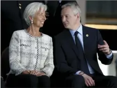  ?? PHOTO/NATACHA ?? Christine Lagarde, managing director of Internatio­nal Monetary Fund (IMF) (left) and Bruno Le Maire, France’s Minister of the Economy and Finance, talk before posing for a group picture at the G20 finance ministers and central bankers summit in Buenos...