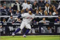  ?? The Houston Chronicle/tns ?? Houston Astros center fielder George Springer gets caught running home, allowing Jose Altuve to advance to third and Michael Brantley to second, on a hit by Michael Brantley during the seventh inning of Game 3 of the American League Championsh­ip Series at Yankee Stadium in New York on Tuesday.