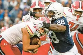 ?? BARRY REEGER/AP PHOTOS ?? Penn State defensive tackle Zane Durant, right, sacks Maryland quarterbac­k Taulia Tagovailoa during Saturday’s game in State College, Pennsylvan­ia.