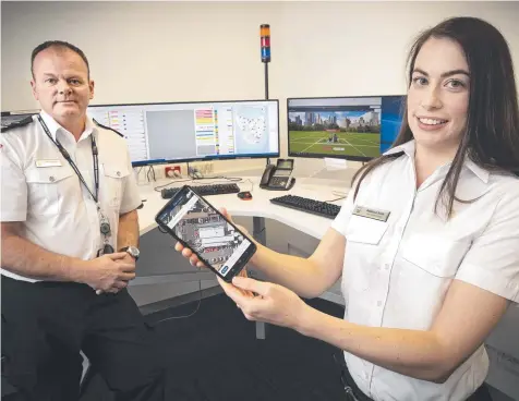  ?? Picture: CHRIS KIDD ?? INGENIOUS: Ambulance Tasmania subject matter expert Nick Bradford and emergency medical dispatch support officer Rebecca Scott demonstrat­e the new What3words geocode system app.
JAMES KITTO