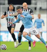  ?? AP ?? Manchester City's Ferran Torres and Newcastle's Jonjo Shelvey (right) during an English Premier League match.