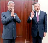  ?? —PTI ?? External affairs minister S. Jaishankar and Chinese foreign minister Wang Yi after a Shanghai Cooperatio­n Organisati­on meeting in Moscow on Thursday.