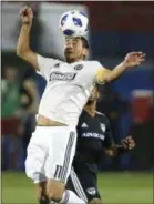  ?? STEWART F. HOUSE — THE ASSOCIATED PRESS ?? Union midfielder Alejandro Bedoya heads the ball during the second half against FC Dallas Saturday night in Frisco, Texas.