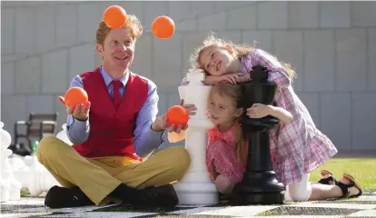  ??  ?? Juggler John Phelan with sisters Erin and Ciara Ocks promoting events at the LexIcon Library
