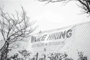  ?? Jenny Kane / Associated Press ?? A sign seeking workers is displayed at a fast food restaurant in Portland, Ore. The national unemployme­nt rate is 4.2 percent, close to what experts consider full employment.