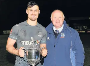  ?? Jackie Meredith ?? ●●Lewis Palfrey with chairman Mark Wynn following January’s Law Cup victory against Oldham