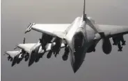  ?? French Defense Audiovisua­l Communicat­ion and Production Unit ?? A French military photo shows Rafale fighter jets flying toward Syria and an Islamic State target.