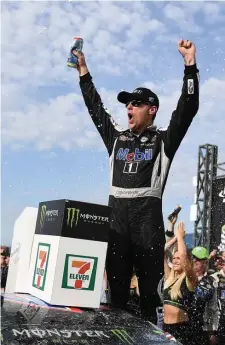  ?? GETTY IMAGES ?? PUMPED: Kevin Harvick celebrates in victory lane yesterday at Michigan Internatio­nal Speedway.