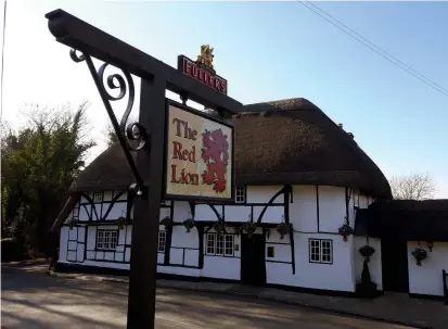  ??  ?? Red Lion pub sign at Chalton in Hampshire. This is the most common pub name in England