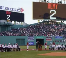  ?? Ap photos ?? REMEMBERIN­G REMY: Beloved former Red Sox player and announcer Jerry Remy is honored prior to Wednesday’s game against the Toronto Blue Jays. At right from left, Sox greats Jim Rice, Fred Lynn and Dwight Evans walk together while being introduced.