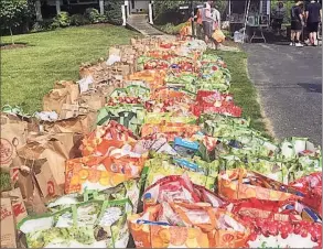  ?? Contribute­d photo ?? Groceries collected by the grassroots initiative Helping Families, a group of parents who stepped in to feed families of school children who received free and reduced meals in Stamford.