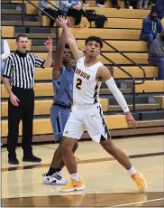  ?? TIM PHILLIS — FOR THE NEWS-HERALD ?? Brush’s Andrew Jones defends a 3-point attempt by South’s David McClain during the Arcs’ 42-34win in a D-I sectional semifinal.