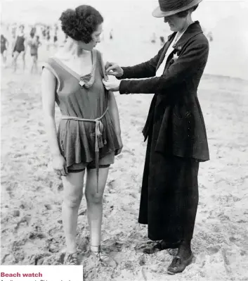  ??  ?? Beach watch
A policewoma­n in ahicago checks a woman is not violating the bathing suit-length laws in 1921. Policewome­n toured recreation­al venues to try to control young women