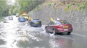  ??  ?? Motorists need to think very carefully before driving through water