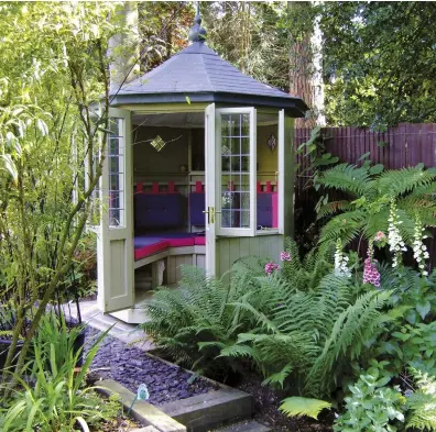  ??  ?? A cosy hideaway for a quiet corner of the garden: ‘Baltimore’ summerhous­e with lockable doors, casement windows and slate- effect glass fibre roof, £ 5,500, Scotts of Thrapston