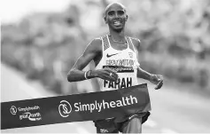  ??  ?? Britain’s Mo Farah wins the men’s elite race of the Great North Run half-marathon in South Shields, north east England on September 10, 2017.The Great North Run is Britain’s largest running event with more than 50,000 participan­ts covering the 13.1...