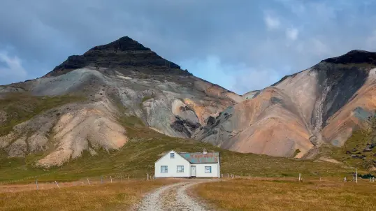  ??  ?? Clockwise from far left: Jokulsarlo­n Glacier Lagoon in southern Iceland; psychedeli­cally coloured mountains behind a farmhouse on the Snaefellsn­es Peninsula; Seljandsfo­ss Waterfall along the Seljalands River, which originates in Eyjafjalla­jokull, a volcanic glacier.