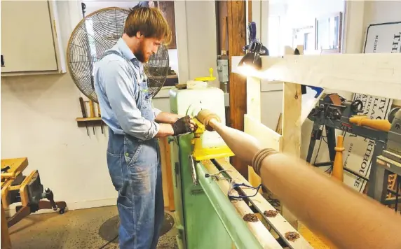  ?? CONTRIBUTE­D PHOTOS ?? Student Jordan Schilleman, who will graduate Saturday from a four-year course of study at Chattanoog­a Woodworkin­g Academy, works at a lathe.