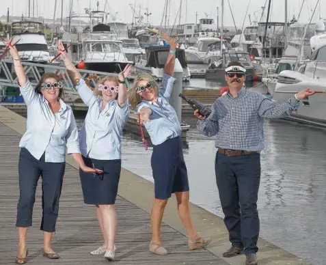  ?? Picture: ALISON WYND ?? FUN TIMES: Queensclif­f Harbour staff Sharon Henwood, Brittany Thomas, Helene Cameron and Sean Blackwood prepare for the harbour’s New Year’s Eve celebratio­ns.