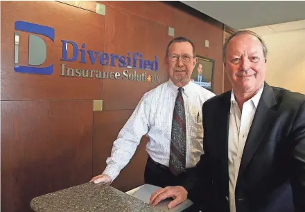  ?? RICK WOOD / MILWAUKEE JOURNAL SENTINEL ?? Karl Cumblad (left), chief financial officer, and Jim McCormack, chairman of Diversifie­d Insurance Solutions, at the company’s Brookfield office. McCormack is selling the company to its employees through an employee stock ownership plan.