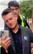  ??  ?? Filming: Tommy Robinson being arrested on Friday