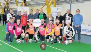  ??  ?? Message Keith Lasley with competitor­s and organisers from the tournament