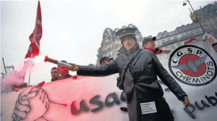  ?? Picture / AP ?? Protesters gather at the Gare de l’Est train station before marching through Paris.