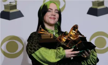  ??  ?? Well-deserved win: Billie Eilish poses with her awards at the 2020 Grammys. Photograph: Monica Almeida/Reuters