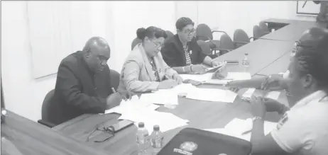  ?? (Photo by Terrence Thompson) ?? Chief Education Officer Marcel Hutson (left) and Permanent Secretary of the Ministry of Education Adele Clarke sign the Terms of Resumption on behalf of the Ministry.