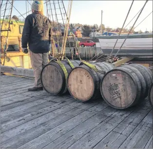  ?? PHOTO COURTESY OF IRONWORKS DISTILLERY ?? Barrels of rum from Ironworks Distillery sit on a wharf before being loaded onto the three-masted tall ship Picton Castle in Lunenburg, N.S.