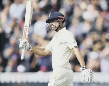  ??  ?? Alastair Cook celebrates reaching his double century during day two of the first Test at Edgbaston.