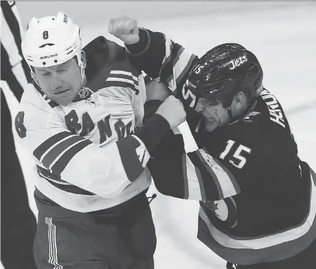  ??  ?? Thirty-six-year-old Winnipeg Jets centre Matt Hendricks, right, says he is excited that the franchise has a fighting chance at a Central Division title.