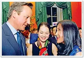 ??  ?? FRIENDS IN HIGH PLACES: With former Prime Minister David Cameron
