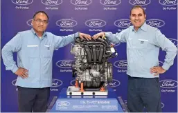  ??  ?? All-New Ford 1.5L TiVCT 3 cylinder engine unveiled by Anil Patel, Ford Engine Plant Manager with Dhiraj Dixit - Ford Sanand Plant Manager.