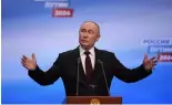  ?? ?? Russian President Vladimir Putin speaks on a visit to his campaign headquarte­rs after a presidenti­al election in Moscow, early Monday, March 18, 2024.