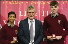  ??  ?? Left: Ted Owens presented Junior Certificat­e Student of the Year Awards to Tara Kancherla and Robert Dunne. Right: Ted Owens, CE of Cork ETB, presented Athletics Awards to Daisey Arrey and Burnley Arrey at the Davis College Awards Ceremony.