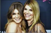  ?? CHRIS PIZZELLO/INVISION/AP, FILE ?? Lori Loughlin, right, poses with Olivia Jade Giannulli at the Women’s Cancer Research Fund’s An Unforgetta­ble Evening in Beverly Hills, Calif., on Feb. 27, 2018.