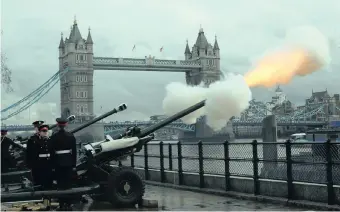  ??  ?? MEMBERS of the Honourable Artillery Company fire a gun salute to mark Queen Elizabeth’s 67th anniversar­y of her accession to the throne, at the Tower of London, yesterday. | Reuters